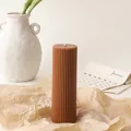 Detail shot of brown ribbed pillar candle showing fine texture on kraft paper - 5*15cm / Brown