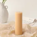 Close-up of ribbed pillar soy candle on kraft paper with a minimalist home decor background - 5*15cm / Beige