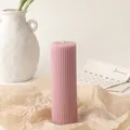 Close-up of pink fluted pillar soy candle on kraft paper with minimalist decor - 5*15cm / Pink