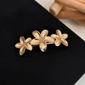 Elegant gold-plated three-flower spring hair clip with detailed metallic floral textures - Gold Large and Small Flower