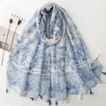 Lightweight Bali yarn scarf with blue floral prints and tassel fringe in a white background - Blue & White Rich Floral (SL2606-007)