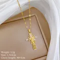 Detailed view of gold cross pendant with micro-inlaid zircon and lip-link chain on silk - Gold Cross (D214)