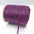 Fuchsia and blue gradient elastic cord with metallic glitter on a white spool - Glitter Webbing (19.)