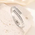 Bracciale geometrico a cerniera argento con zirconi rettangolari e finitura lucida - Stile Cerniera Bypass / Argento