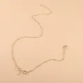 Minimalist gold bow pendant necklace with delicate chain and adjustable lobster clasp - Gold