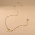 Minimalist gold bow pendant necklace with delicate chain and adjustable lobster clasp - Gold