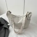 Minimalist beige corduroy crossbody bag with adjustable strap and cloud charm - White