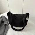 Minimalist black corduroy crescent bag with adjustable strap and cute dog pendant - Black