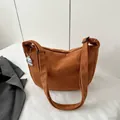 Caramel corduroy crossbody bag with soft texture and cute white puppy charm - Tan
