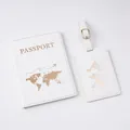 Detail of white PU leather passport cover and luggage tag with gold world map embossing - Luggage Tag / White