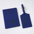 Detail of dark blue faux leather passport holder and luggage tag set with map embossing - Dark Blue