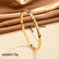 Detail view of 18k gold plated stainless steel bangle with 60mm diameter and 4mm width - 47# 4mm Curved Surface - Gold Sz620