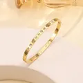 Detail of 18k gold plated stainless steel cuff with Roman numerals and crystals - 42# 4mm Hollow Roman Style - Gold Sz653