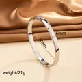 Close-up of 6mm silver stainless steel bangle with dimensions and weight specs - 49# 6mm Curved Surface - Steel Color Sz614