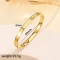 Macro shot of 18k gold plated titanium steel bracelet showing 6mm width and Roman numerals - 40# 6mm Roman Numeral Polished Finish - Gold Sz643