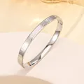 Detailed close-up of polished silver steel bangle featuring Roman numeral engravings - 41# 6mm Roman Numeral Polished Steel Color Sz642