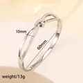 Macro detail of silver knot bracelet with crystal inlay and 60mm inner diameter dimension - 59# Steel Color Sz570