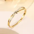 Detail of 18k gold plated stainless steel bangle with pavé-set crystals in a twist design - 60# Gold Sz571