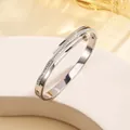 Close-up of double-layer stainless steel bangle with pavé-set zircons and polished finish - 63# Steel Color Sz546