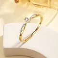 Close-up of 18k gold plated bangle with sparkling main crystal and pavé diamond details - 65# Gold Sz595