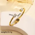 Detailed view of 18k gold plated stainless steel hinge bracelet with rhinestone accents - 67# Gold Sz601
