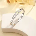 Detail of silver titanium bangle with interlocking pave-set cubic zirconia crystals - 72# Steel Color Sz603