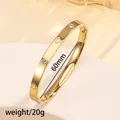 Detail of 18K gold-plated bangle with heart engravings and inset zircon stones - 20# Gold Sz625