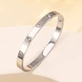 Macro detail of silver titanium steel bracelet with heart cutouts and inlaid diamonds - 21# Steel Color Sz624