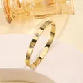 Polished 18k gold plated titanium steel bangle with inlaid zircons and side clasp lock - #6 Ten Diamonds - Gold Sz637