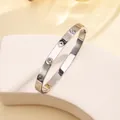 Silver stainless steel bangle with sparkling crystals and engraved four-leaf clovers - 18# Four-leaf Clover With Diamonds - Steel Color Sz660