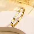 Gold plated stainless steel bangle with alternating screw patterns and crystals - 33# One Nail One Diamond - Gold Sz670