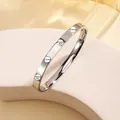 Polished silver stainless steel bangle with screw motifs and diamond accents - 34# One Nail One Drill - Steel Color Sz669