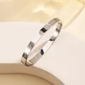 Polished silver titanium steel open bangle with engraved screw motifs for women - 53# Steel-colored Screws (sz665)