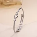 Minimalist silver-toned cable twist open bangle with polished bead center in stainless steel - 91# Steel Color Sz044