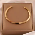 Minimalist 18k gold plated stainless steel open cuff bracelet with a polished flat surface - 107# Möbius - Golden Sz020