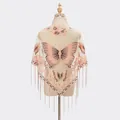 Champagne lace shawl featuring butterfly embroidery and fine fringe detail on mannequin - Snow Bud
