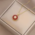 Detailed view of sunflower pendant with red petals and diamonds on gold chain - X4539-6