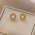 Detail of purple marquise-cut zircon daisy stud earrings with a golden metal base - E1304--1