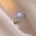Macro detail of rotating sunflower ring with purple crystals and adjustable silver band - J0803--4