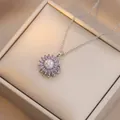 Close-up of rotating sunflower pendant with purple petals and sparkling diamonds - X4539--4
