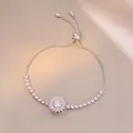 Detail of adjustable silver bracelet with pink zircon sunflower on champagne silk - Ts0671-3