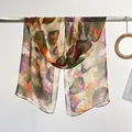 Lightweight chiffon long scarf with orange and green leaf prints on cream background - Green Leaves
