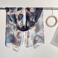Long silk-feel scarf featuring vintage blue and orange leaf patterns with sheer texture - Blue Leaves