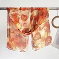 Detailed texture of lightweight leaf pattern scarf in warm orange and yellow tones - Leaf Yellow