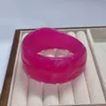 Irregular vibrant pink resin wide bangle with a polished translucent finish - Inner Diameter 67.2mm / Weight 67g / Rose Red White Silk