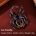 Spider brooch in black alloy with purple crystals and teardrop gemstone, 6.0cm x 5.0cm - YNCP8427 Purple Spider