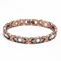 Macro detail of red copper magnetic bracelet with sparkling crystals and health magnets - White Diamond Magnetic Bracelet In Bronze Color