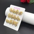 Exquisite 14k gold-plated floral earrings with sparkling cubic zirconia on a display card - Flower Studs (017)