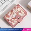 Floral card holder in white leather with 20 card slots and magnetic pink strap closure - {snap-on Style} - Elegant White Orchid