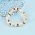 Ceramic ocean theme bracelet with starfish and seashell beads in a natural beige finish - 1741-02 Listening to the Sea Conch